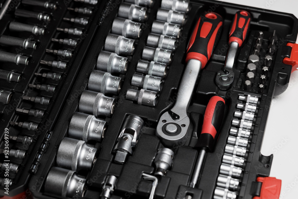 A large set of tools in a black box close-up. Nozzles of different sizes A large set of tools in a black box close-up. Nozzles of different sizes