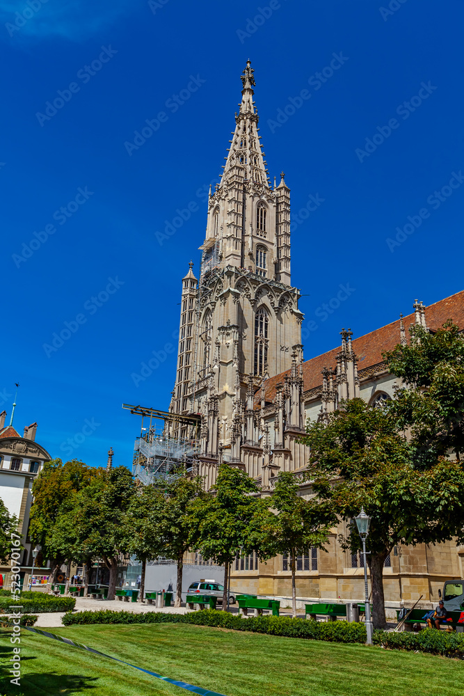 BERN, SWITZERLAND - August 2nd 2022: Spire Bernese Cathedral (Berner Münster). View from the Münsterplatform.
