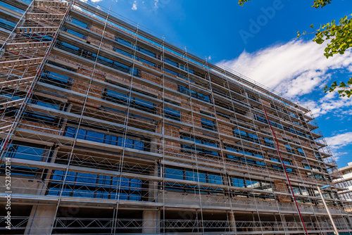 Works on the installation of the facade on one of the office buildings. Geneva, Switzerland. July 2022.