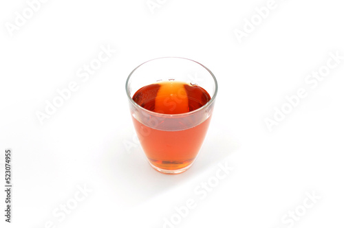 glass with tea on a light background