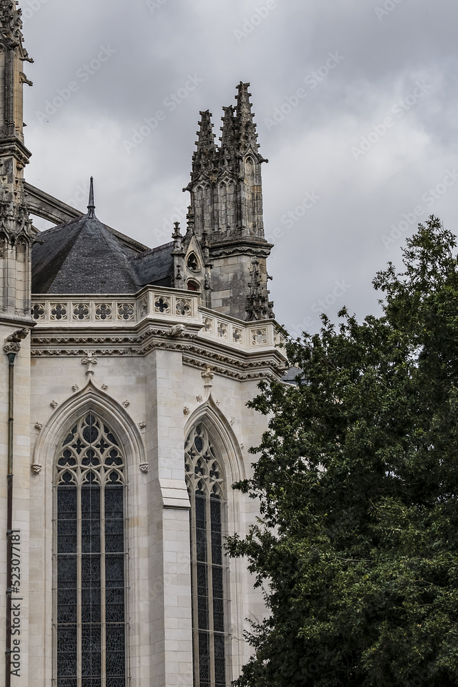 Architectural detail of Roman Catholic Gothic St. Peter and St. Paul Cathedral (Cathedrale Saint-Pierre-et-Saint-Paul) in Nantes. Construction began in 1434. Nantes, Loire Atlantique, France. Architectural detail of Roman Catholic Gothic St. Peter and St. Paul Cathedral (Cathedrale Saint-Pierre-et-Saint-Paul) in Nantes. Construction began in 1434. Nantes, Loire Atlantique, France.