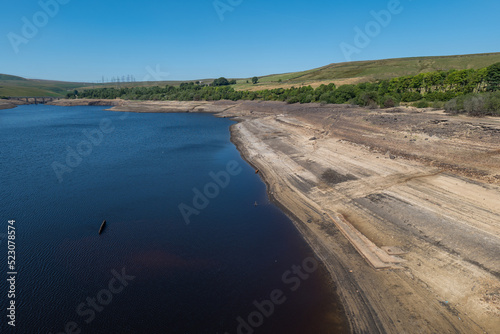 Baitings Reservoir near Ripponden, West Yorkshire, part of Yorkshire Water's series of reservoirs. Drought conditions across England causing depleted water levels. © PhotographyBradley
