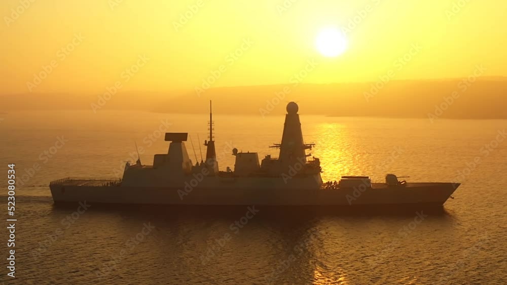 Royal Navy type 45 daring class destroyer sailed through Bosporus against sun in mist for Blacksea port of Odesa, home of Ukrainian Navy. A modern air defence guided missile destroyer