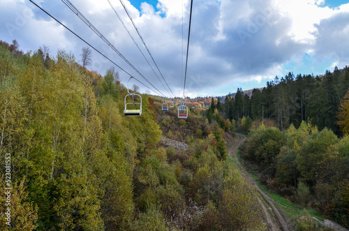 Mountain landscape with chairlift on autumn forest background. Carpathian Mountains, Ukraine 