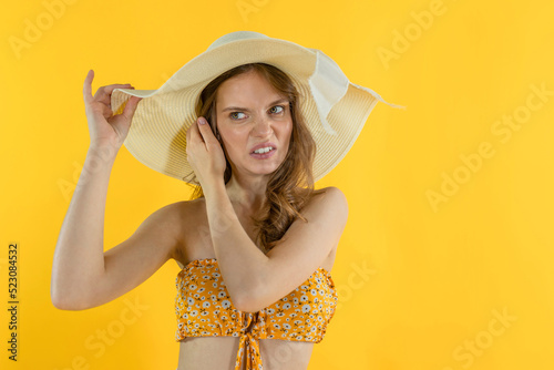 A young woman has itching and scratching of her hair and scalp. Annoyed by the wrong purchase choice woman. Not satisfied with the purchase in the female store