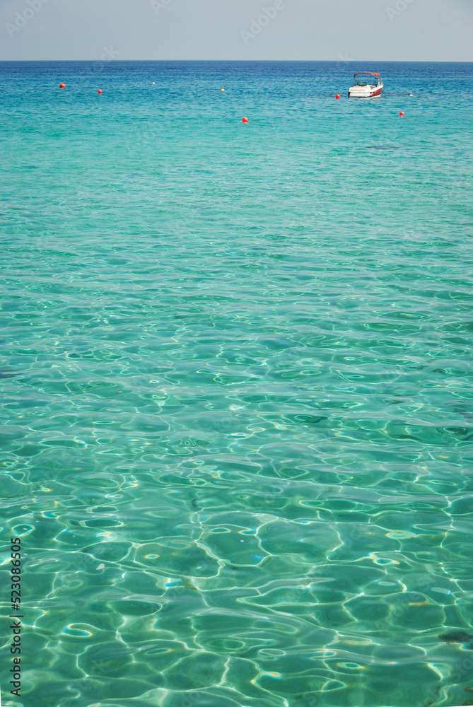 still life of nature, turquoise sea and boat on the horizon still life of nature, turquoise sea and boat on the horizon