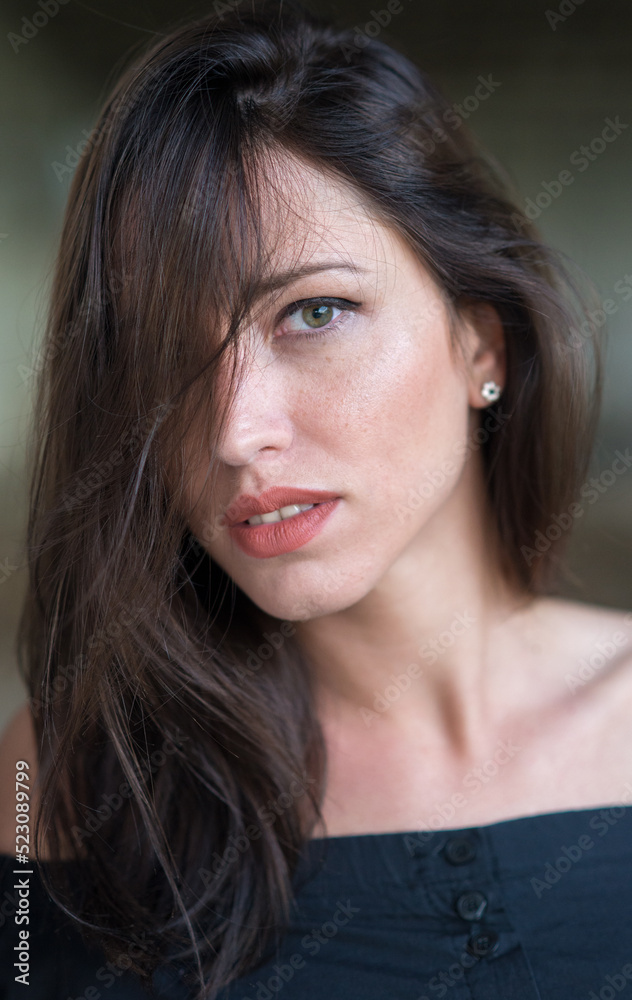 Portrait of beautiful young woman with green eyes and long brown hair Portrait of beautiful young woman with green eyes and long brown hair