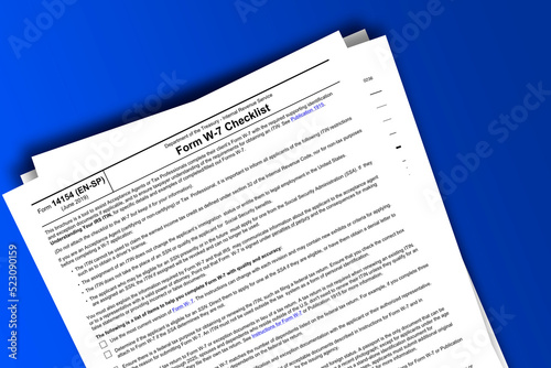 Form 14154 (EN-SP) documentation published IRS USA 43805. American tax document on colored photo