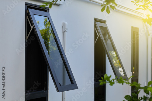 Black frame aluminium windows of building.