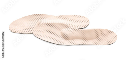 Beige comfortable orthopedic insoles isolated on white © New Africa