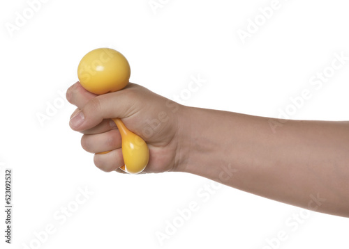 Man squeezing yellow stress ball on white background, closeup