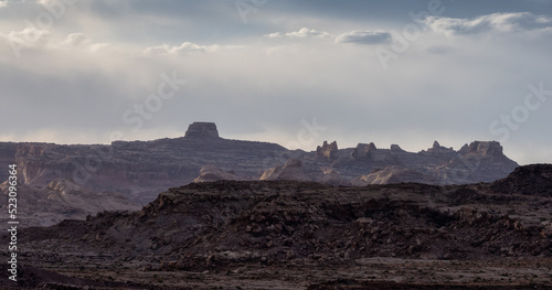 Rugged Mountain Rock Formations in the desert with dramatic clouds at sunset. Utah, United States of America. Nature Background.