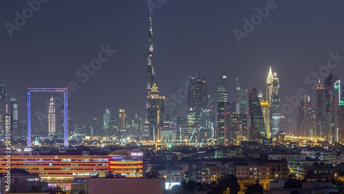 Wallpaper Mural Dubai creek landscape day to night transition timelapse with illuminated modern buildings and downtown skyscrapers skyline. Aerial top view from above Torontodigital.ca
