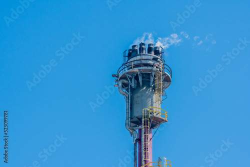 Gas burning at gas pressure release tower natural gas production plant.