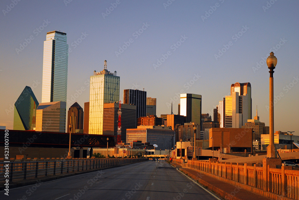 The Dallas Skyline towers over the Commerce Street Bridge and reflects the setting sun in the windows The Dallas Skyline towers over the Commerce Street Bridge and reflects the setting sun in the windows