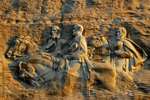 Jackson, and Jefferson Davis, ride horseback at a controversial carving at Stone Mountain, Georgia, near Atlanta photo