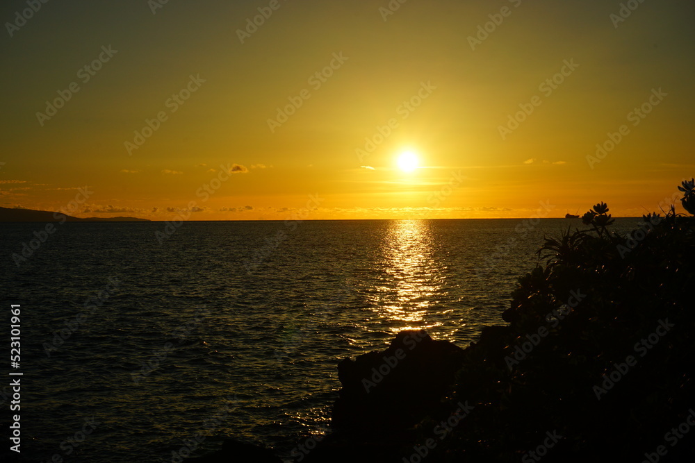 Obraz premium Beautiful Sun down, Sunset at Beach in Ishigaki-jima Island, Okinawa, Japan - 日本 沖縄 石垣島 琉球観音埼灯台 海 夕日
