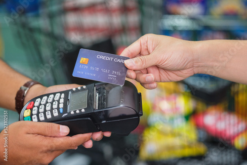 A Man paying credit card and entering pin code on credit card swipe machine for package promotion zero interest, webinar banner shopping product financial transactions pay later
