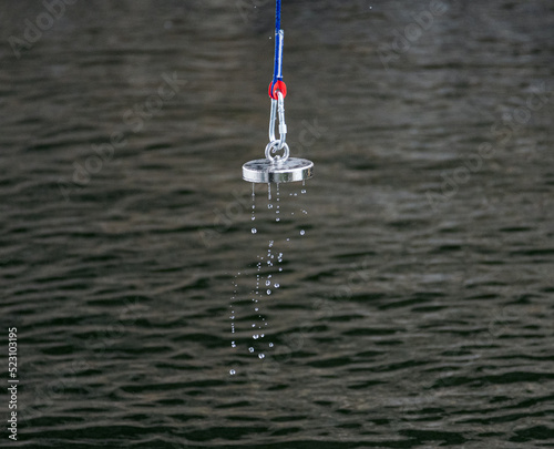 fishing magnet falling in water