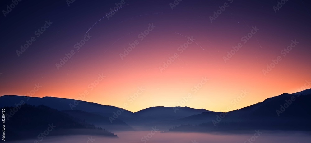 Mountains before dawn. Dawns in the sky and fog in the valley.