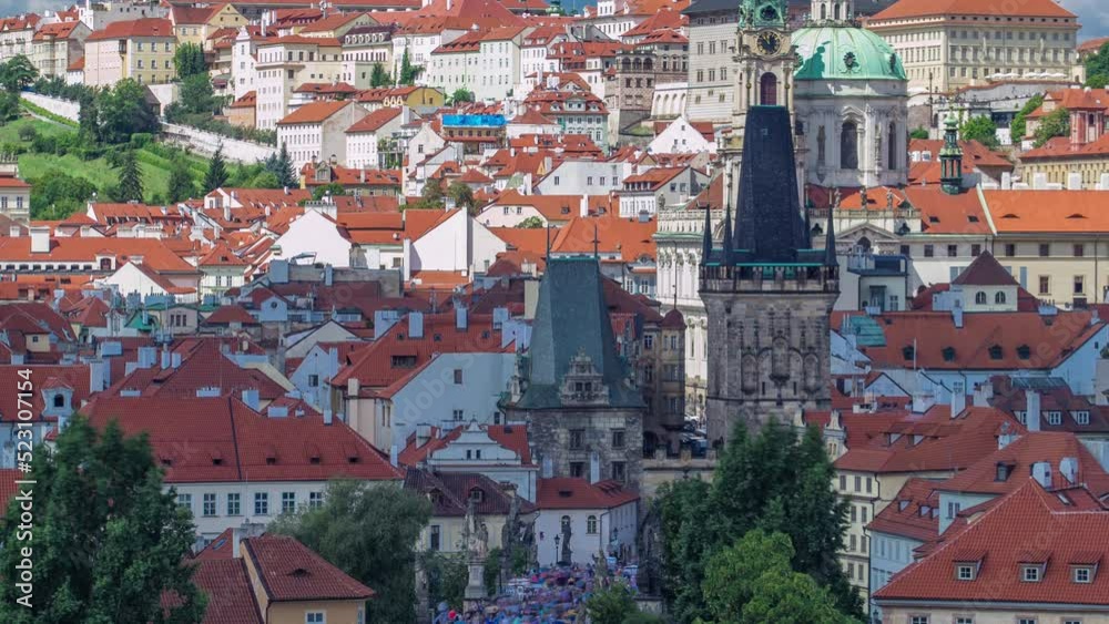 Charles Bridge (Karluv Most) and Lesser Town Tower timelapse, in the background St. Nicholas church and the castle. Top close up view from the Old Town Bridge tower. Charles Bridge (Karluv Most) and Lesser Town Tower timelapse, in the background St. Nicholas church and the castle. Top close up view from the Old Town Bridge tower.