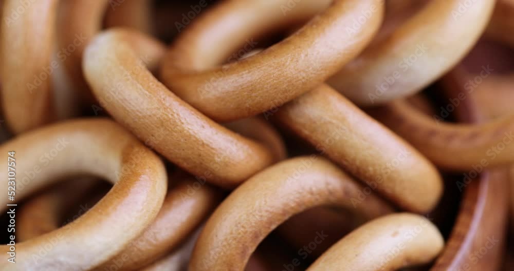 spinning traditional crispy and dry bread product, traditional Slavic food bagels made of wheat flour spinning traditional crispy and dry bread product, traditional Slavic food bagels made of wheat flour