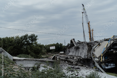 Irpen, Kyiv region, Ukraine - July 15, 2022: Remains of a blown up bridge that collapsed during the Russian-Ukrainian war.