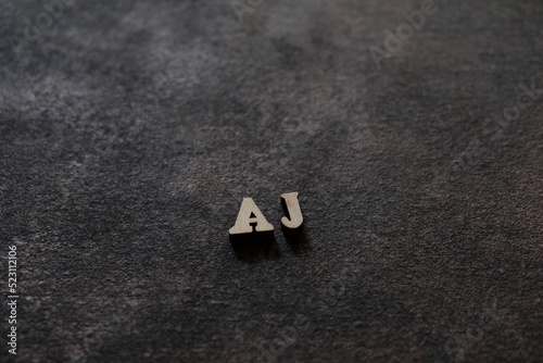Fototapeta Naklejka Na Ścianę i Meble -  The letters A and J above the dark field. Initials AJ