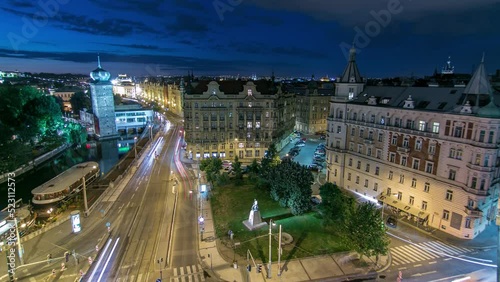 Sitkovska water-tower aerial night timelapse and traffic on road in old city center of Prague. World Heritage Site of UNESCO. View from top of dancing house photo