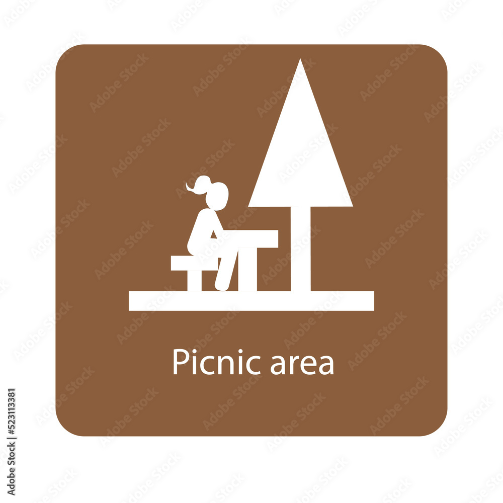 Picnic area sign with a girl sitting on a picnic table under a tree
