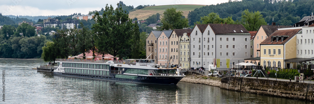 PASSAU, GERMANY -  JULY 12, 2019:   Panorama of the river cruise ship Monarch Princess on the river Danube by the Old Town