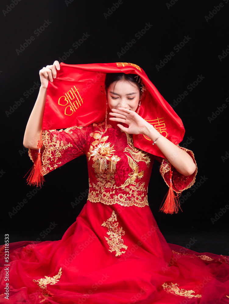 A woman in a red Traditional Chinese wedding dress A woman in a red Traditional Chinese wedding dress