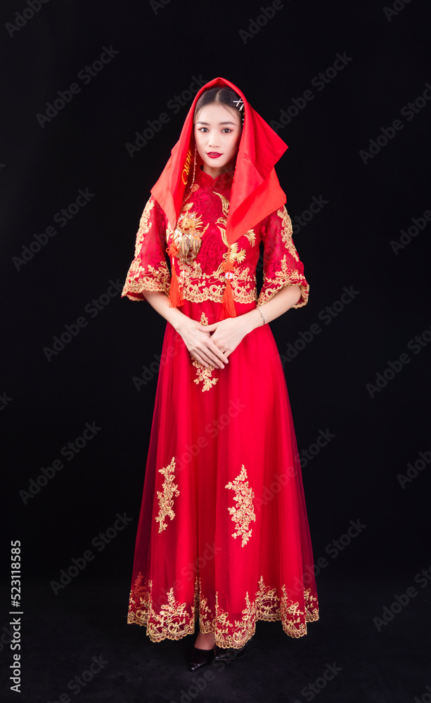A woman in a red Traditional Chinese wedding dress