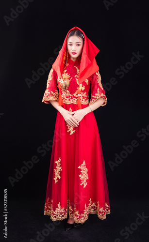 A woman in a red Traditional Chinese wedding dress