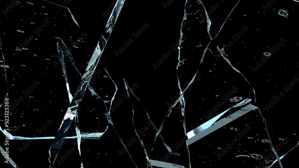Super Slow Motion Shot of Real Glass Break Isolated on Black Background.