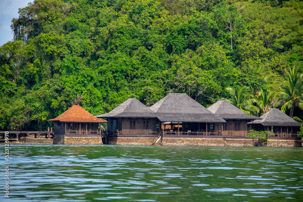 An inn house made of wooden planks on the beach An inn house made of wooden planks on the beach