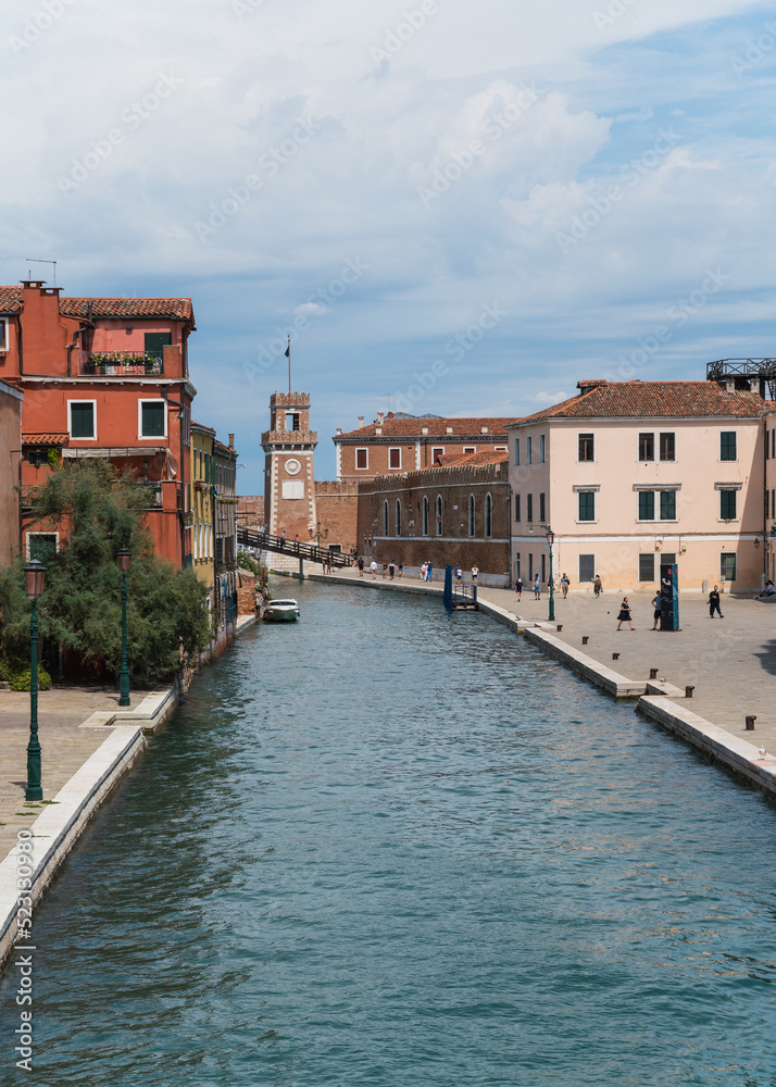view of a canal and Arsenale in the background in Venice, Italy