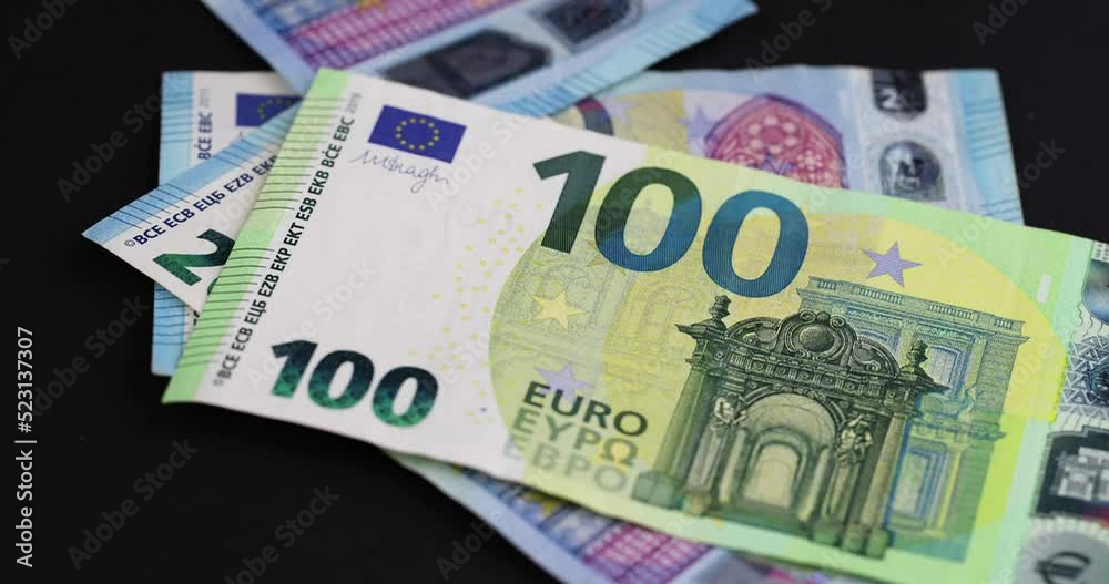 put euro banknotes of the European Union on black paper, put euros on black paper
