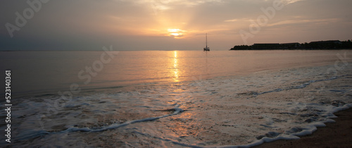 Sailboat anchored at the bay and scene of morning 