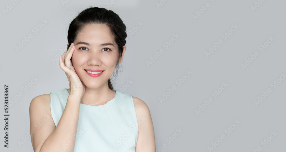 Asian beautiful woman touch her face with smile, happiness and love of skin. Skin care ,wrinkle and beauty concept Asian beautiful woman touch her face with smile, happiness and love of skin. Skin care ,wrinkle and beauty concept