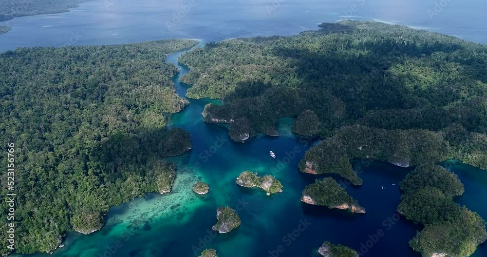 Aerial shot of diving boat anchored in bay with turquoise water