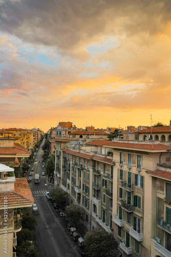 Fototapeta premium Sunset over Rome, Italy from the roof of a residential apartment building