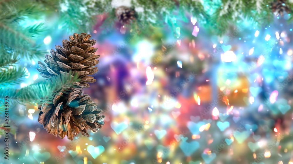 Christmas tree branch with cone on blue blurred festive bokeh confetti snow flakes on background copy space template banner 