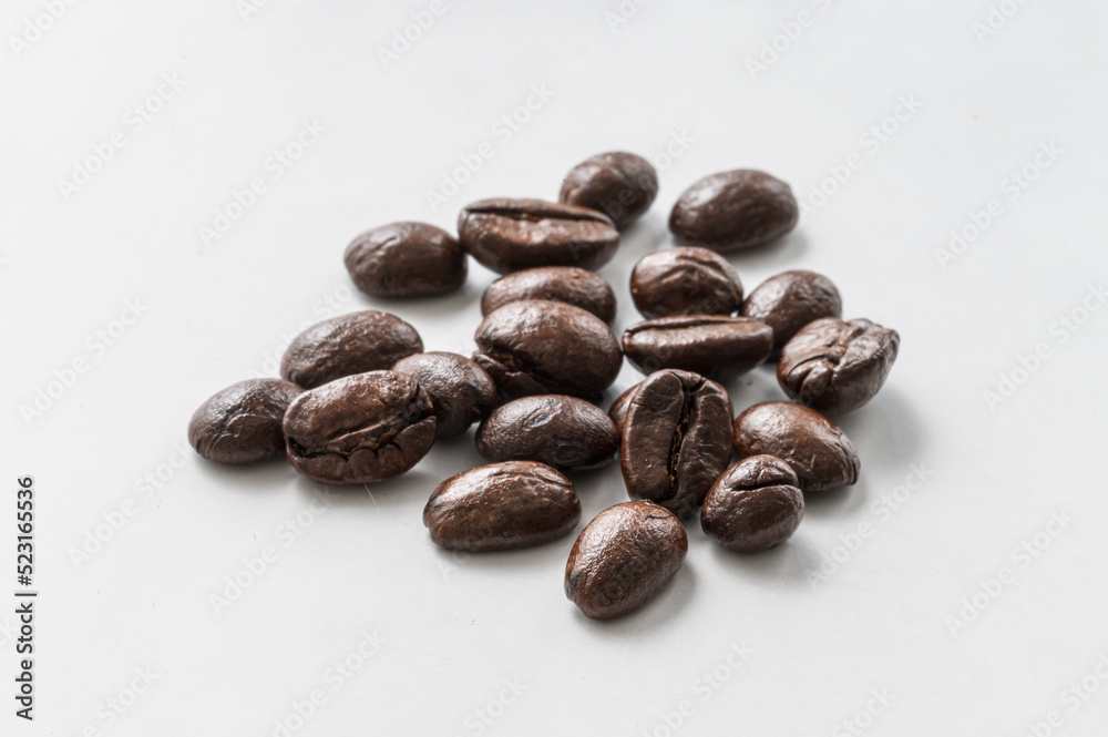 Coffee beans macro close-up, white background Coffee beans macro close-up, white background