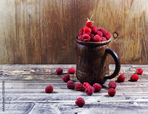 Raspberries in a wooden glass on a wooden background