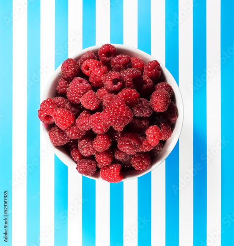Raspberries on a striped background
