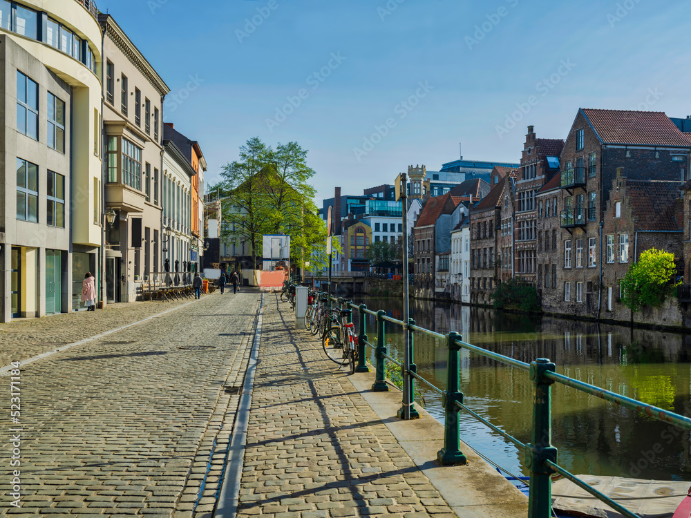 River side street and colorful medieval buildings in Ghent, Belgium