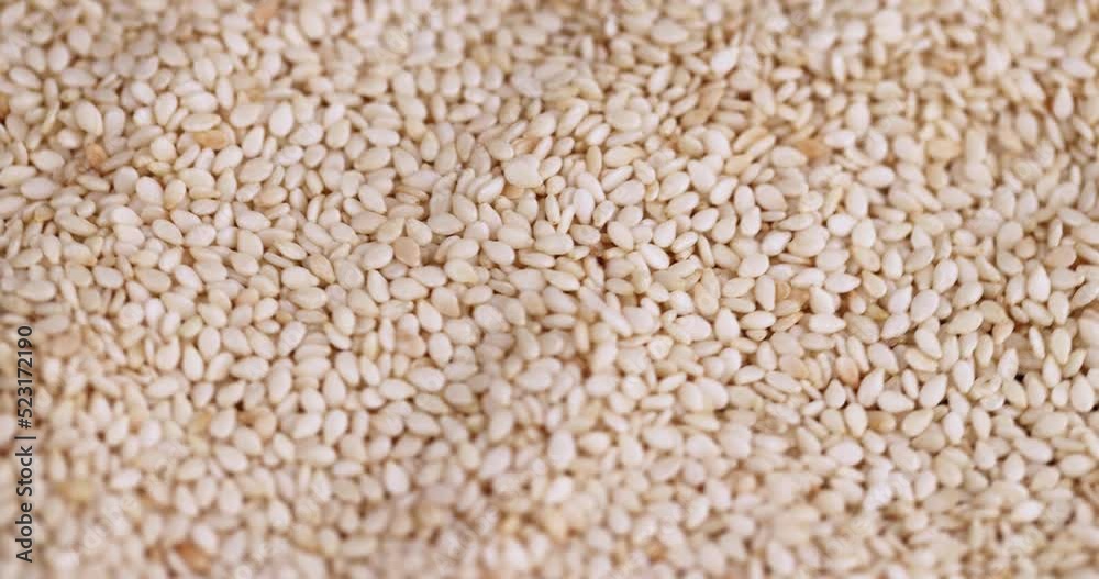 a bunch of white sesame seeds are spinning in a circle, more sesame seeds for cooking dishes and desserts