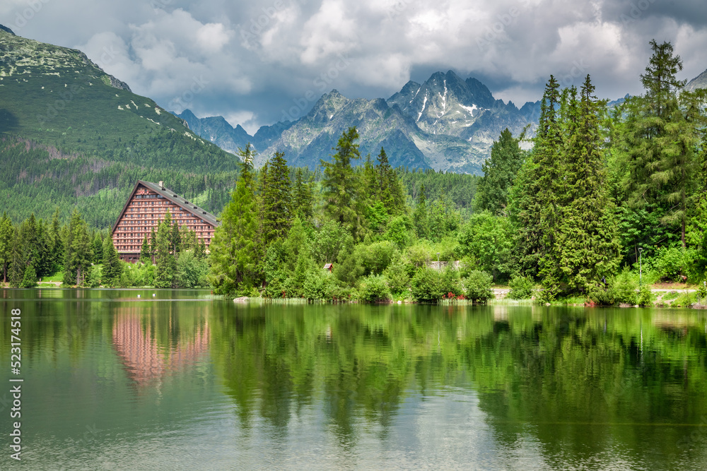 Fototapeta premium Forest and mountain lake in Strbske Pleso in Slovakia