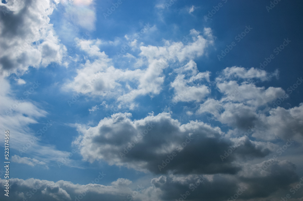 Beautiful white cumulus clouds in the blue sky